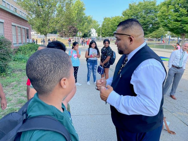 Supt. Javier Montanez gives a pep talk to students at Woods Young Elementary School in Providence on Monday, the first day of school in the city.